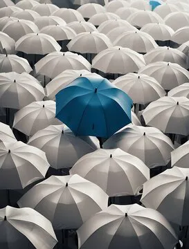 Blue umbrella standing out among a crowd of identical white umbrellas, symbolizing individuality, uniqueness, and creative leadership in a uniform environment