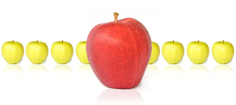 Big Red Apple Standing with Green Apples