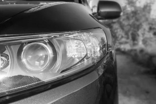 Car headlights. black and white toning. Copy space