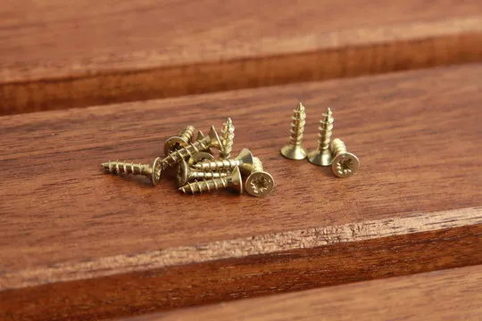 golden star screws, in colorful background