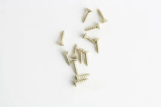 golden star screws, in colorful background