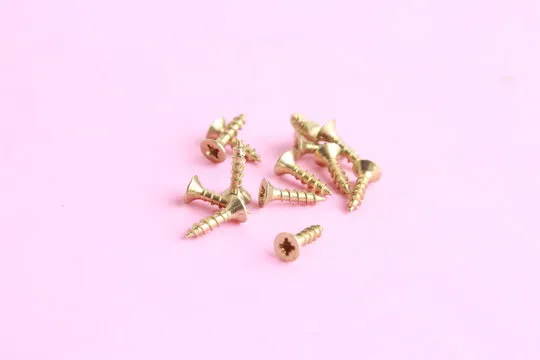 golden star screws, in colorful background