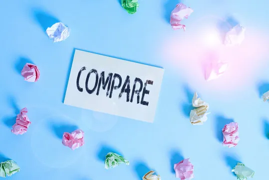 Word writing text Compare. Business photo showcasing Estimate Measure Note the similarities dissimilarities between Colored crumpled rectangle shaped reminder paper light blue background