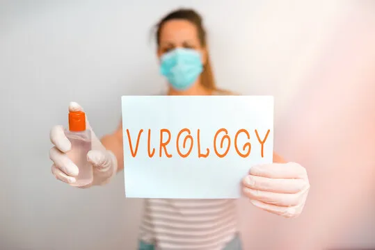Text sign showing Virology. Business photo showcasing branch of science dealing with the variety of viral agents and disease Promoting health awareness with set of medical precautionary equipment